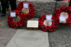 A photograph of the memorial stone for Major Bromley VC with poppy wreaths