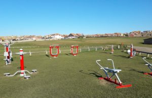 A photograph of the Salts outdoor gym with the cricket/rugby pitches in the background.