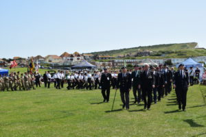 A photographs of veterans marching at Armed Forces Day at Martello Fields