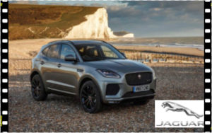 A photo of the company Jaguar's car advert on the beach in front of cliffs