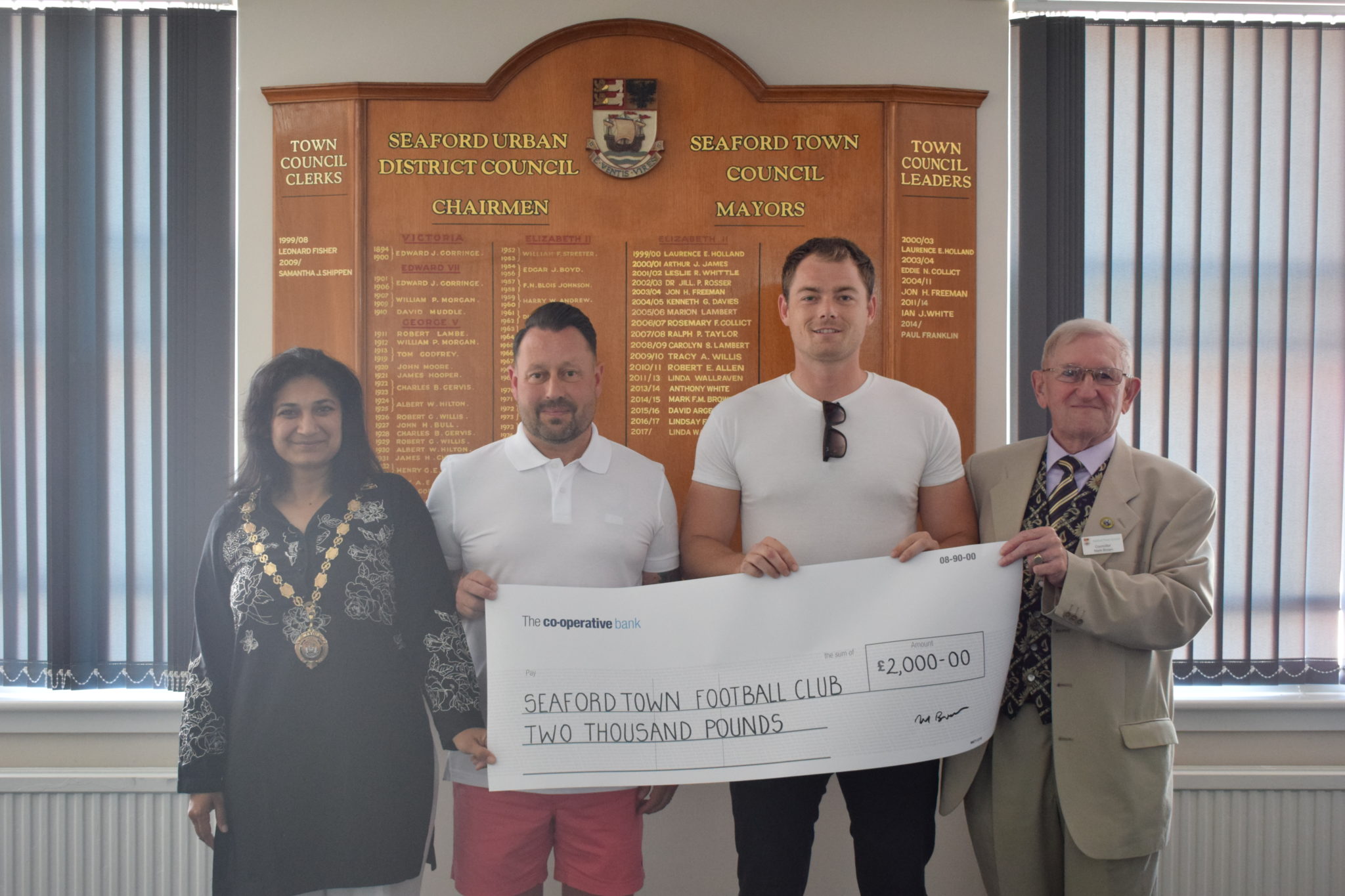 A photograph of Seaford Town Football Club representatives receiving the £2000 grant cheque from Seaford Town Council
