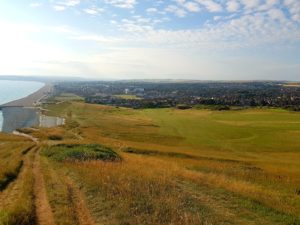 Seaford Head Golf Course from the cliff on a sunny day.