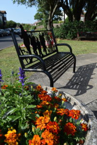 A photo of a war memorial bench