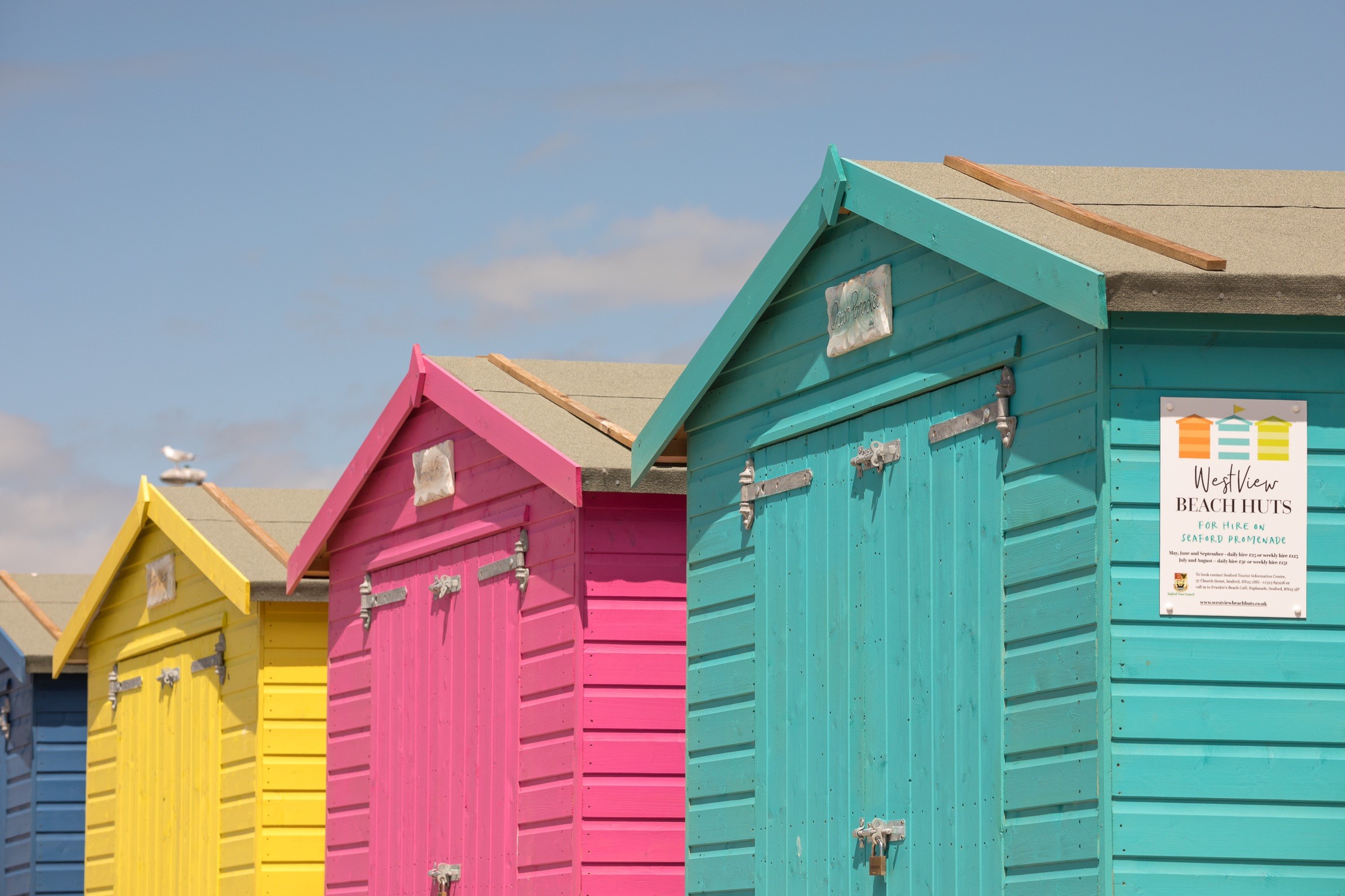 Close up colourful beach huts.