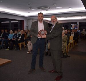 A Man IS PRESENTED WITH AN AWARD FROM THE MAYOR AT SEAFORD TOWN FORUM