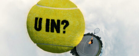Tennis ball above tennis court