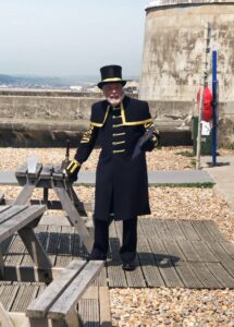 town crier Peter White in front of the Martello Tower
