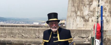 town crier Peter White in front of the Martello Tower