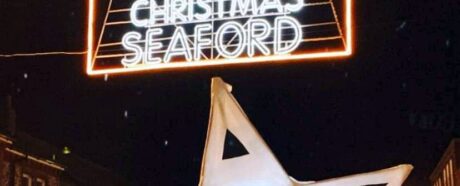 Merry Christmas Seaford in lights on shopping area with lit up lanterns