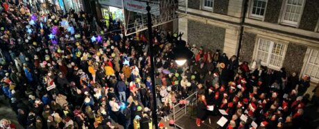 assembled choir in broad street gather together with lantern parade