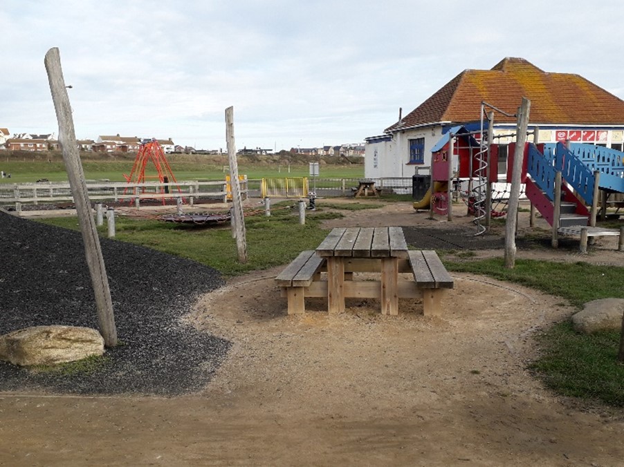 picture of current pathways in the playarea in need of works