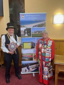 The Mayor of Seaford standing with the Town Crier, Peter White.
