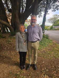 The Mayor and Deputy Mayor standing outside with a large tree in the background.