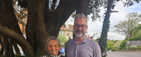 The Mayor and Deputy Mayor standing outside with a large tree in the background.