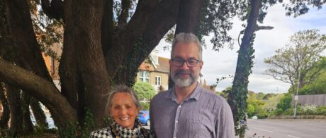 The Mayor and Deputy Mayor standing outside with a large tree in the background.