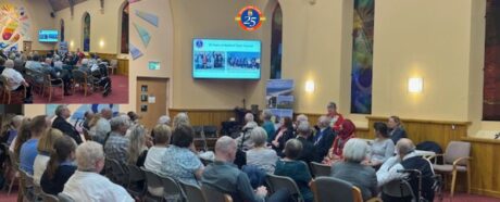 Members of the public sitting at a town council meeting.