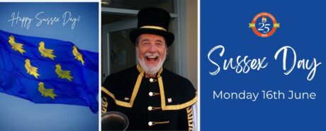 The Sussex Flag and Peter White the Town Crier in his uniform.