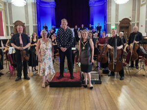 The Mayor of Seaford with the Mayor of Eastbourne, the Worshipful Cllr Margaret Bannister and Conductor/ Musical director Simon Polton-Gower.