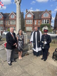 Mayor of Seaford,, James Hollingsworth St Leonards vicar, Linda W and Heidi the bugler in front of recently installed memorial plate 