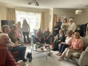 The Mayor of Seaford attending a Macmillan coffee morning at a local residents house.