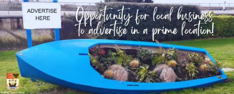 Blue boot on it's side with colourful bedding plants/flowers instead it.